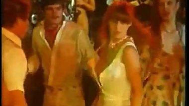 Girl jacks off dude in disco and gets fucked in retro porn movie