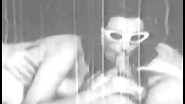 A hot brunette slut in sunglasses sucks a guy off and gets banged from the back