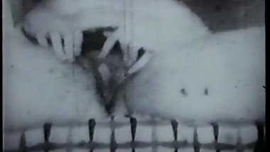 Black and white footage of thick chick with hairy pussy sucking cock on sofa