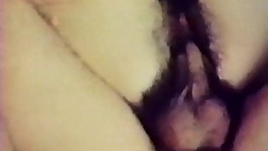 Cute brunette babes with hairy pussy get fucked on couch