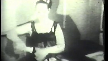 Sexy brunet in lingerie plays with a dildo in her tight pussy