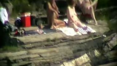 Wife having fun with strangers at beach. Public nudity