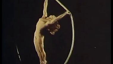 Nude female circus acrobat